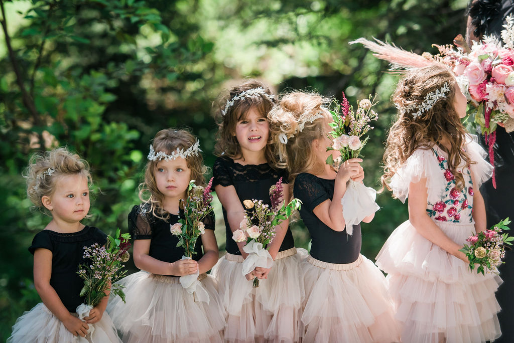 Flower girls with bouquets and hair flowers